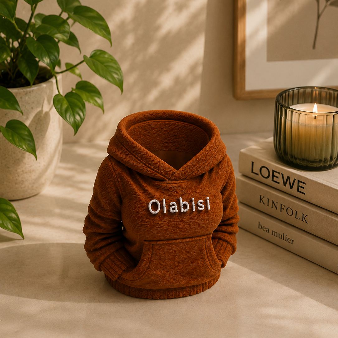 Female Hoodie Shaped Pen holder with name Olabisi in brown colour