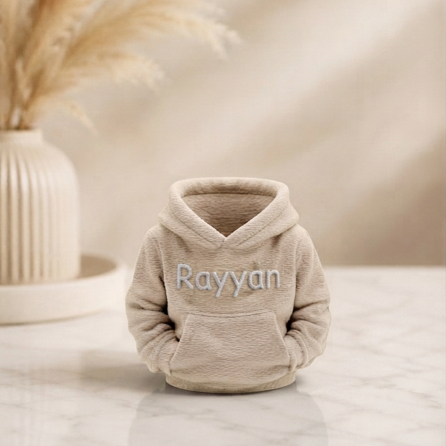 Personalised miniature hoodie desk organiser in beige PLA with name Rayyan in white lettering